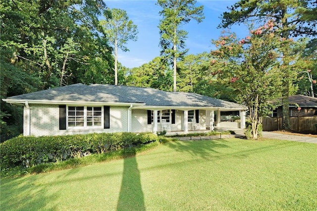 ranch-style home with a front lawn