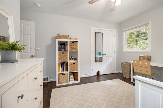 bedroom featuring ceiling fan, a closet, and dark hardwood / wood-style floors