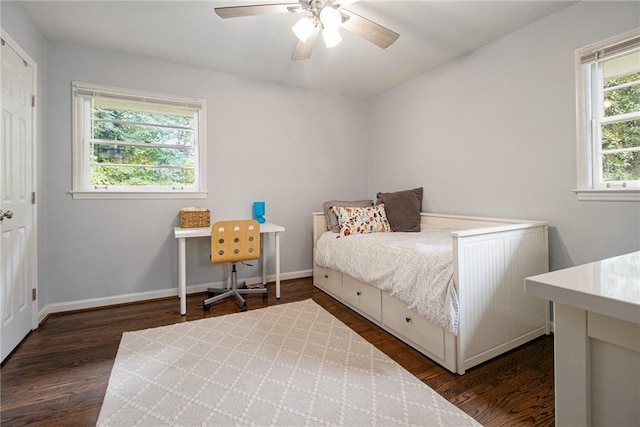 bedroom featuring ceiling fan and dark hardwood / wood-style floors