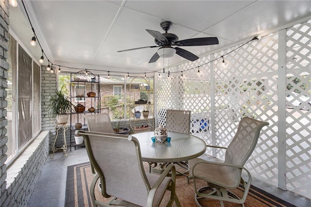 sunroom featuring ceiling fan