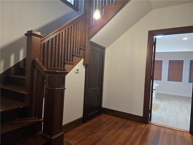 stairs with hardwood / wood-style floors