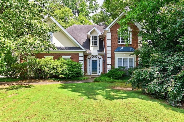 2866 Wynford Dr SW, Marietta, GA 30064 - traditional-style home featuring a front lawn, brick siding, and a shingled roof