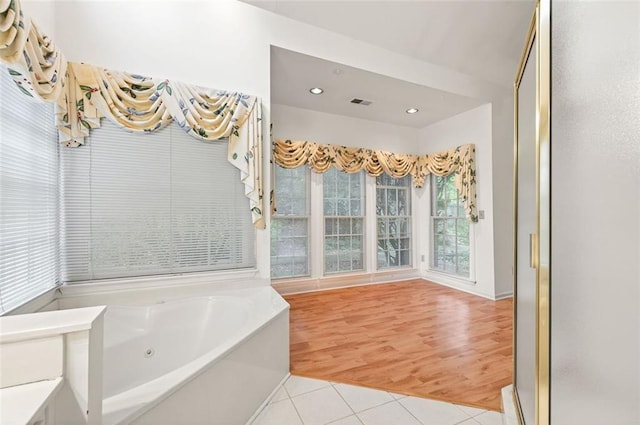 2866 Wynford Dr SW, Marietta, GA 30064 - bathroom featuring tile patterned floors, a tub with jets, a stall shower, and recessed lighting