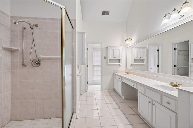 2866 Wynford Dr SW, Marietta, GA 30064 - bathroom featuring a shower stall, double vanity, tile patterned floors, and a walk in closet
