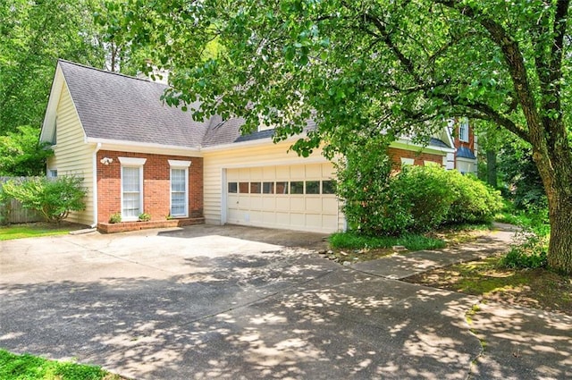 2866 Wynford Dr SW, Marietta, GA 30064 - view of front of house featuring brick siding, concrete driveway, roof with shingles, and an attached garage