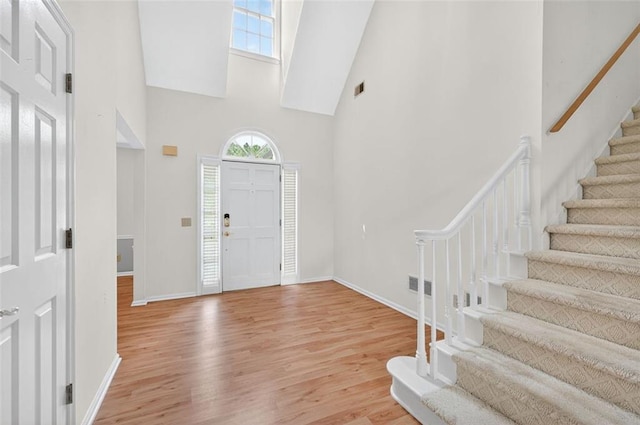 2866 Wynford Dr SW, Marietta, GA 30064 - foyer with a towering ceiling, stairs, and wood finished floors