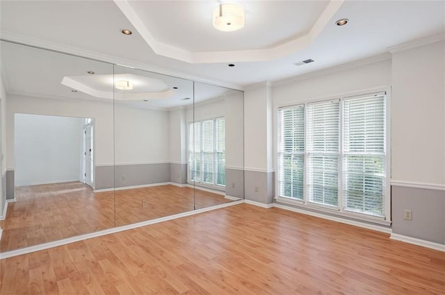 2866 Wynford Dr SW, Marietta, GA 30064 - empty room with a raised ceiling, light wood-type flooring, and ornamental molding