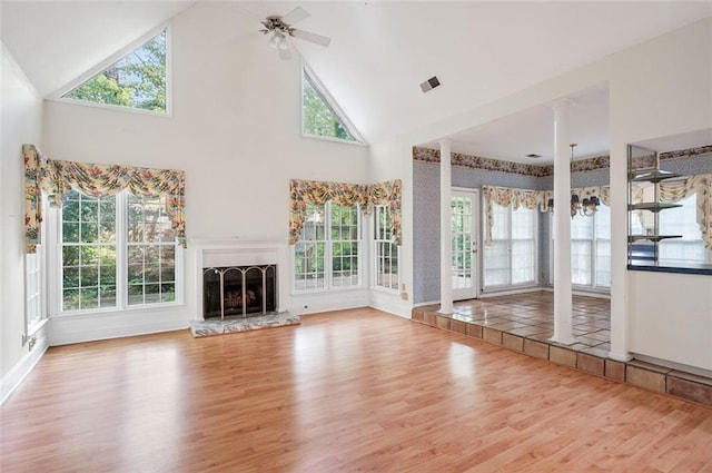 2866 Wynford Dr SW, Marietta, GA 30064 - unfurnished living room featuring wood finished floors, high vaulted ceiling, a ceiling fan, and a fireplace with raised hearth