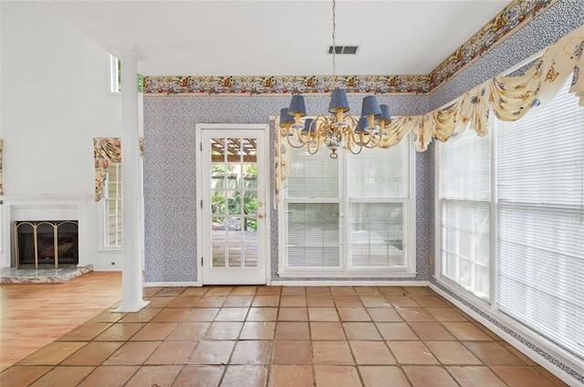 2866 Wynford Dr SW, Marietta, GA 30064 - unfurnished dining area with wallpapered walls, a chandelier, a baseboard radiator, and a fireplace with raised hearth