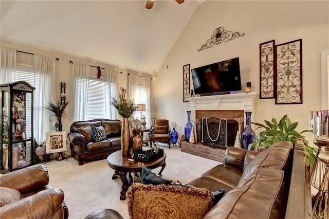 living room with a fireplace, carpet flooring, high vaulted ceiling, and ceiling fan