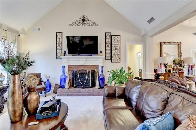 living room with carpet floors, high vaulted ceiling, a brick fireplace, and crown molding