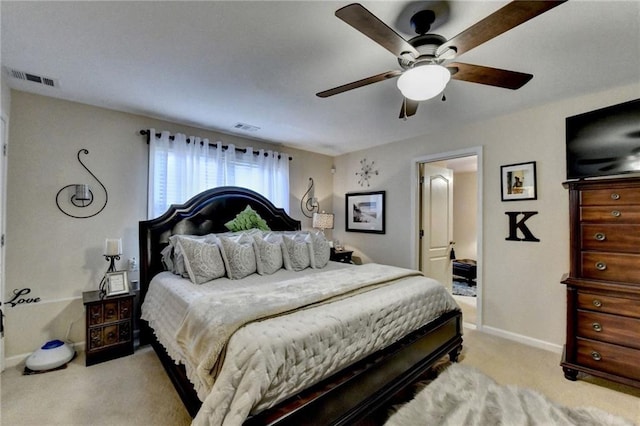 bedroom featuring ceiling fan and light carpet