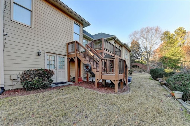 rear view of property featuring a yard