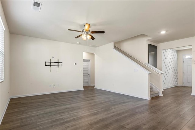 2296 Waycross Ln, Dacula, GA 30019 - unfurnished living room featuring ceiling fan, dark wood finished floors, stairway, baseboards, and recessed lighting