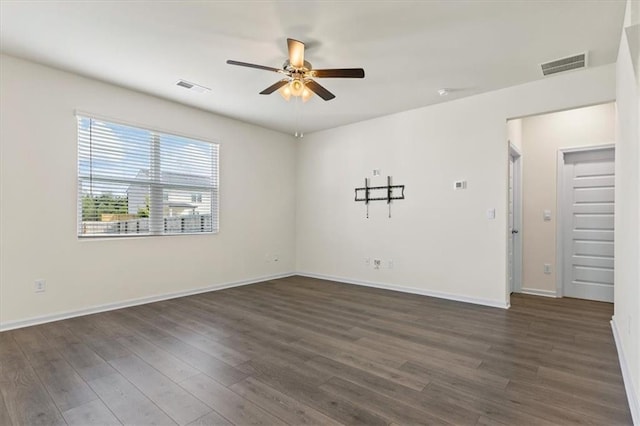 2296 Waycross Ln, Dacula, GA 30019 - unfurnished room featuring a ceiling fan, dark wood-style floors, and baseboards