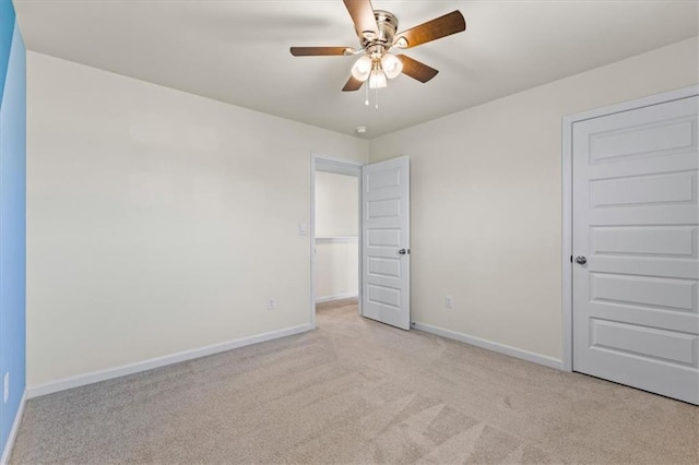2296 Waycross Ln, Dacula, GA 30019 - unfurnished bedroom featuring carpet flooring, baseboards, and a ceiling fan