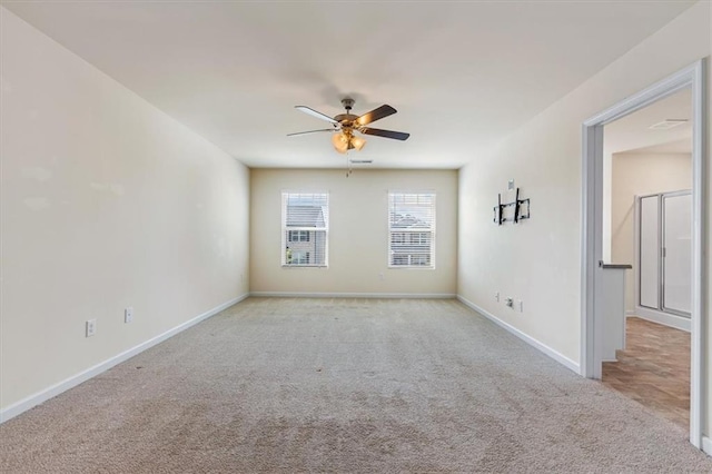 2296 Waycross Ln, Dacula, GA 30019 - unfurnished room with light colored carpet, a ceiling fan, and baseboards