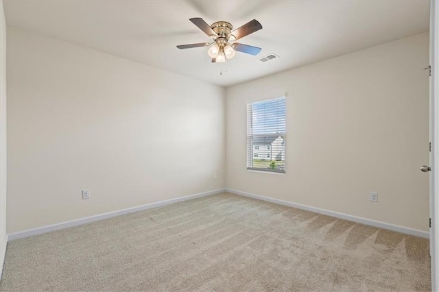 2296 Waycross Ln, Dacula, GA 30019 - spare room featuring light colored carpet, baseboards, and a ceiling fan