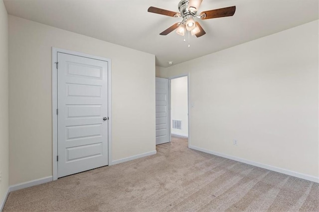 2296 Waycross Ln, Dacula, GA 30019 - unfurnished bedroom with carpet floors, baseboards, and a ceiling fan