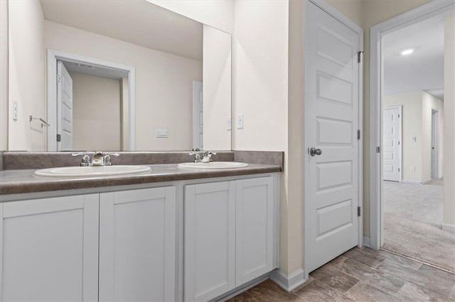2296 Waycross Ln, Dacula, GA 30019 - bathroom featuring double vanity and baseboards