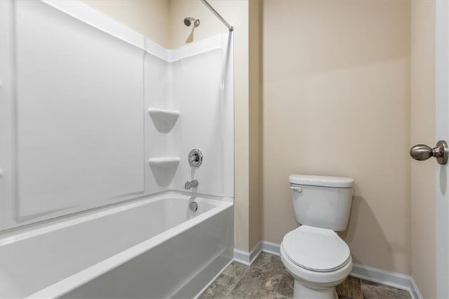 2296 Waycross Ln, Dacula, GA 30019 - full bathroom with baseboards, shower / tub combination, and toilet