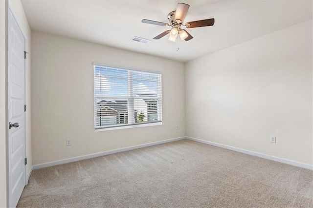 2296 Waycross Ln, Dacula, GA 30019 - unfurnished bedroom with light colored carpet, baseboards, and ceiling fan