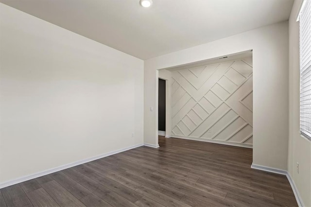 2296 Waycross Ln, Dacula, GA 30019 - spare room with dark wood-type flooring, baseboards, and recessed lighting