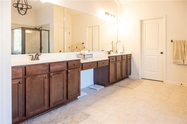 bathroom with vanity and a stall shower