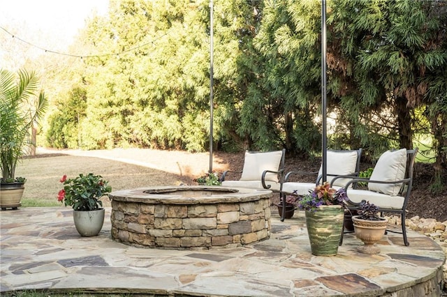 view of patio / terrace with a fire pit