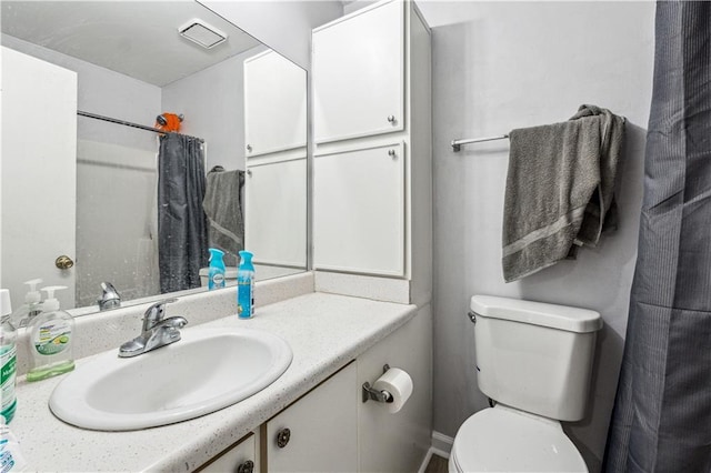 bathroom with vanity and toilet