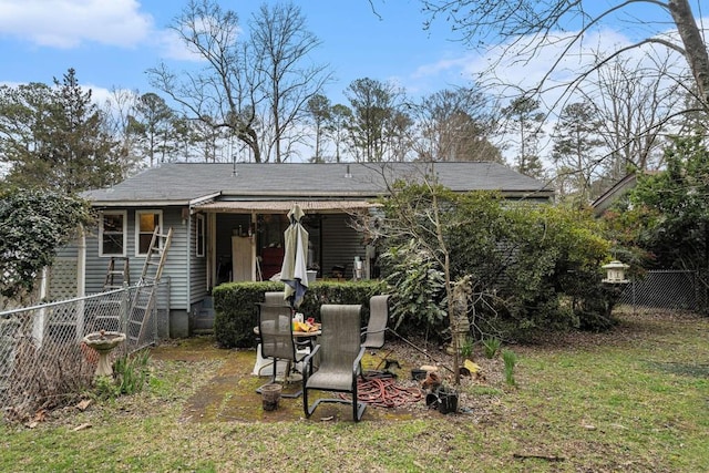 rear view of property with fence