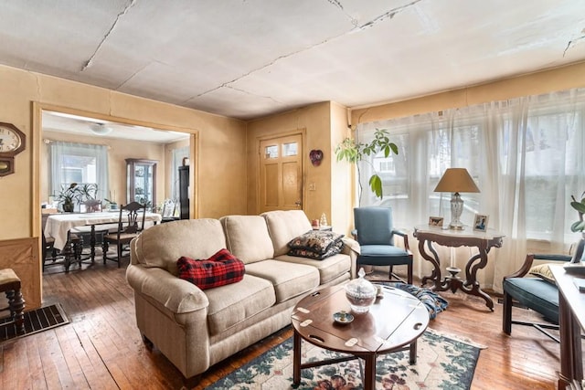 living room with plenty of natural light and wood-type flooring