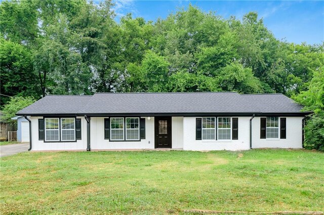 ranch-style house with a front lawn