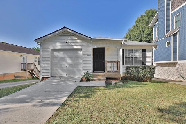 ranch-style house featuring concrete driveway, an attached garage, and a front yard