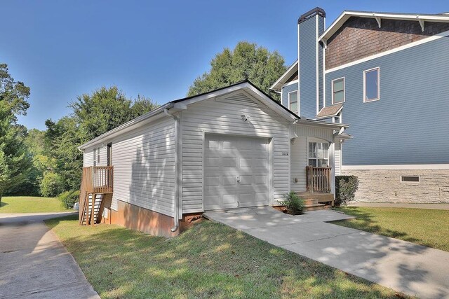 view of property exterior featuring an attached garage, driveway, a chimney, and a yard