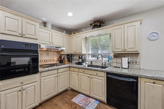 1487 W Bend Creek Ct, Atlanta, GA 30338 - kitchen featuring black appliances, a sink, under cabinet range hood, wood finished floors, and cream cabinetry