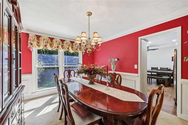 1487 W Bend Creek Ct, Atlanta, GA 30338 - dining space featuring ornamental molding, light carpet, a chandelier, a wainscoted wall, and a decorative wall