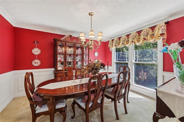 1487 W Bend Creek Ct, Atlanta, GA 30338 - carpeted dining space featuring a chandelier, ornamental molding, wainscoting, and a textured ceiling