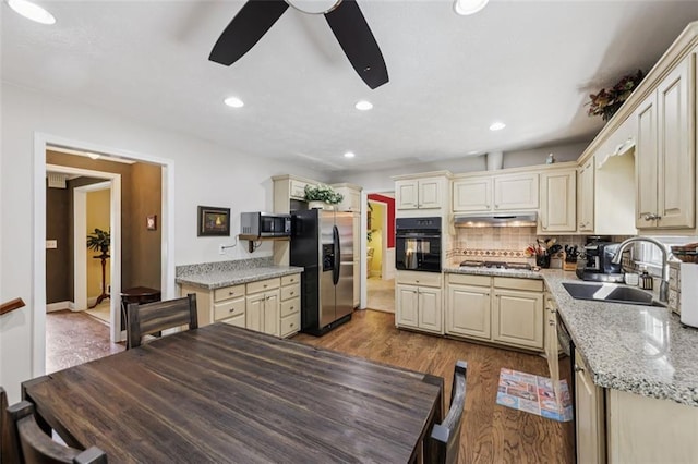 1487 W Bend Creek Ct, Atlanta, GA 30338 - kitchen featuring black appliances, cream cabinetry, a sink, ceiling fan, and wood finished floors