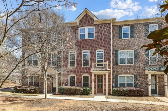 multi unit property featuring brick siding