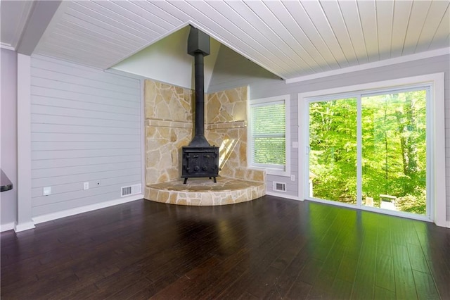 unfurnished living room with a wealth of natural light and wood-type flooring