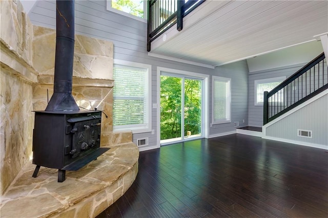 living room featuring hardwood / wood-style flooring and a wood stove