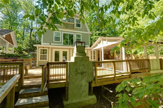 rear view of house with a wooden deck