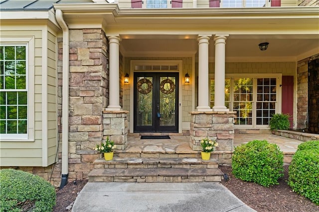 519 River Estates Parkway, Canton, GA 30115 - entrance to property with french doors, covered porch, and stone siding