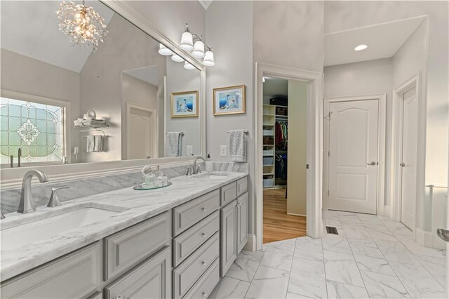 519 River Estates Parkway, Canton, GA 30115 - full bath with double vanity, lofted ceiling, a sink, and marble finish floor