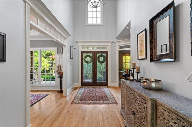 519 River Estates Parkway, Canton, GA 30115 - foyer entrance with a high ceiling, an inviting chandelier, french doors, baseboards, and light wood-type flooring