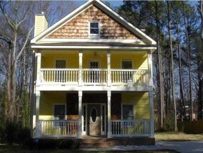 2968 Hapeville Rd SW, Atlanta, GA 30354 - view of front of property with a balcony, a porch, and a chimney