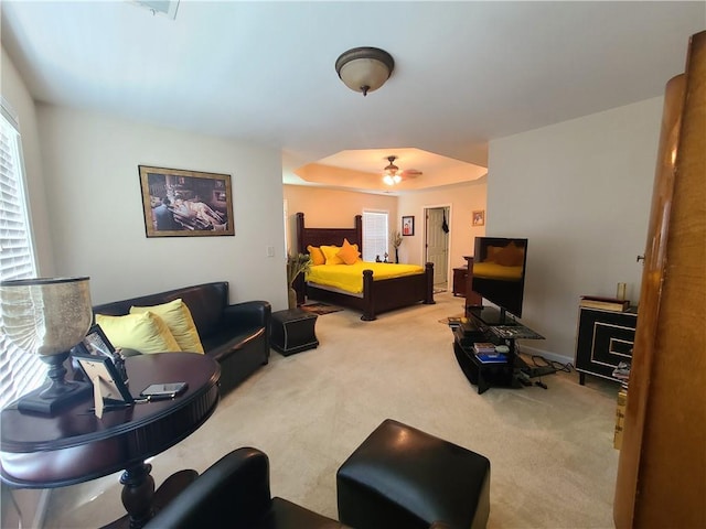 carpeted living room with ceiling fan