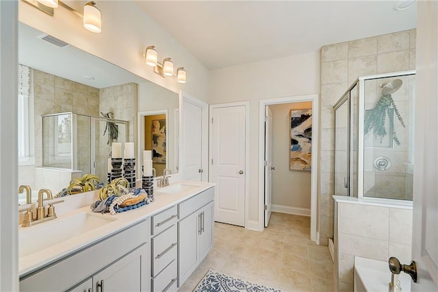82 Sheryl Way, Loganville, GA 30052 - bathroom with a stall shower, double vanity, and a garden tub
