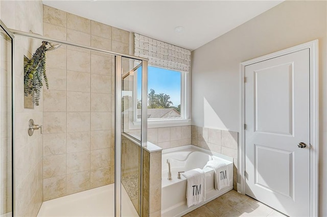 82 Sheryl Way, Loganville, GA 30052 - bathroom with a garden tub, a stall shower, and tile patterned floors